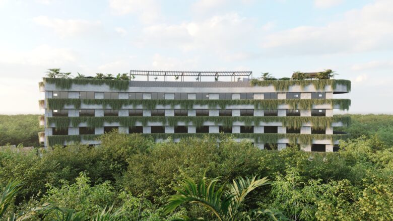 Vista aérea de Macondo Tulum, edificio rodeado de selva con diseño arquitectónico orgánico, terrazas con vegetación colgante y rooftop con alberca, parte de los departamentos en venta en Tulum.